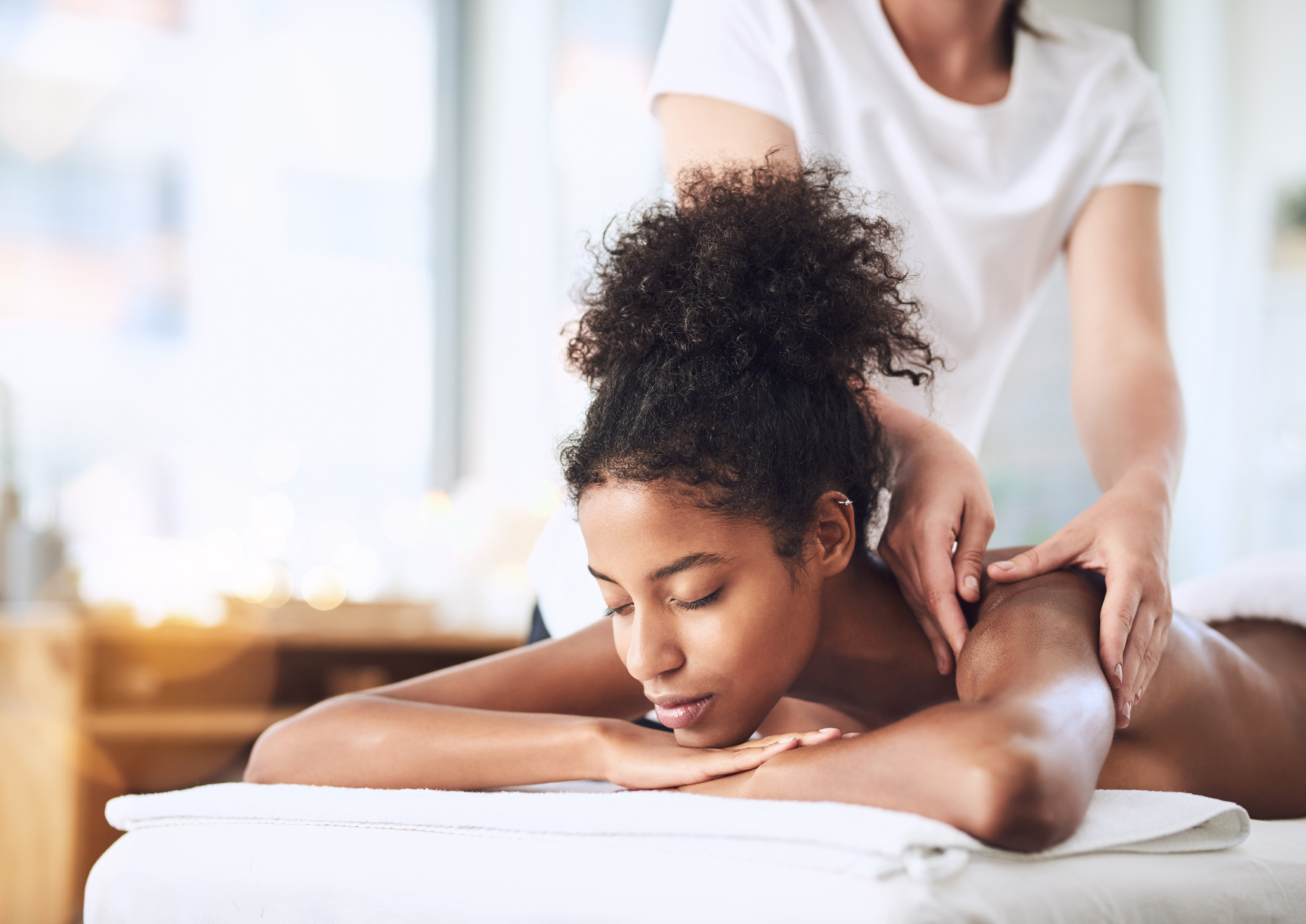 Woman Getting A Massage At A Resort Spa