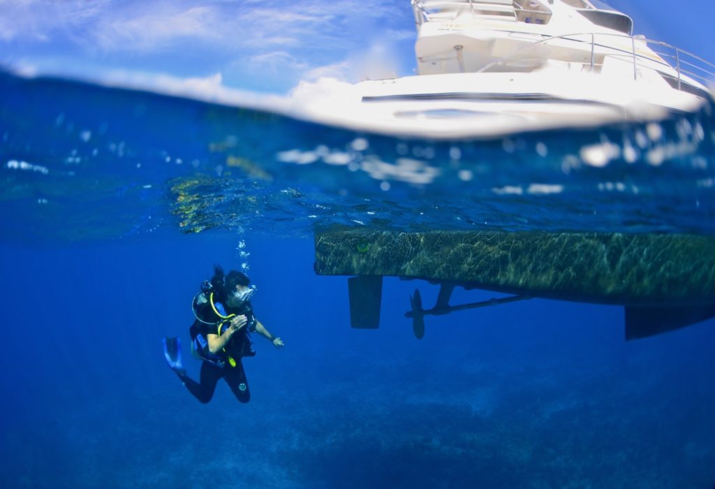 Scuba Diver In Clear Water Off Of Turks And Caicos