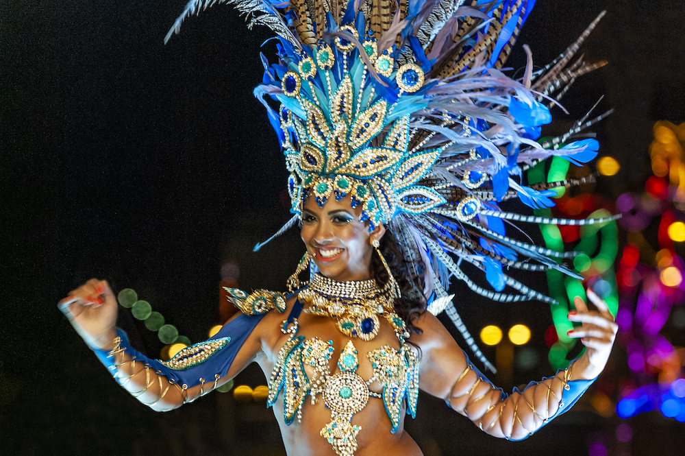 close up of a woman in costume at carnival celebration 